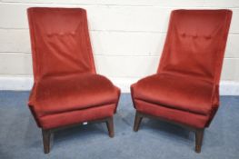A PAIR OF MID CENTURY TEAK FRAMED GREAVES AND THOMAS COCKTAIL/LOUNGE CHAIRS, with red upholstery,