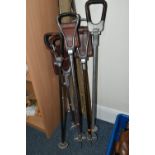THREE VINTAGE FISHING RODS AND FIVE SHOOTING STICKS, comprising a cane rod by George Wilkins & Son