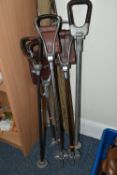 THREE VINTAGE FISHING RODS AND FIVE SHOOTING STICKS, comprising a cane rod by George Wilkins & Son