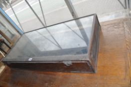 A LATE 19th CENTURY TABLE TOP DISPLAY CABINET with scratched glass top and mahogany beeding, side