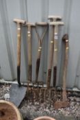 SIX VARIOUS GARDENING TOOLS, to include four pitchforks, a shovel and an axe (condition - all in