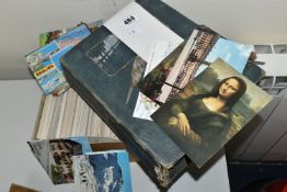 POSTCARDS one album and one box containing over 500 early 20th century postcards featuring