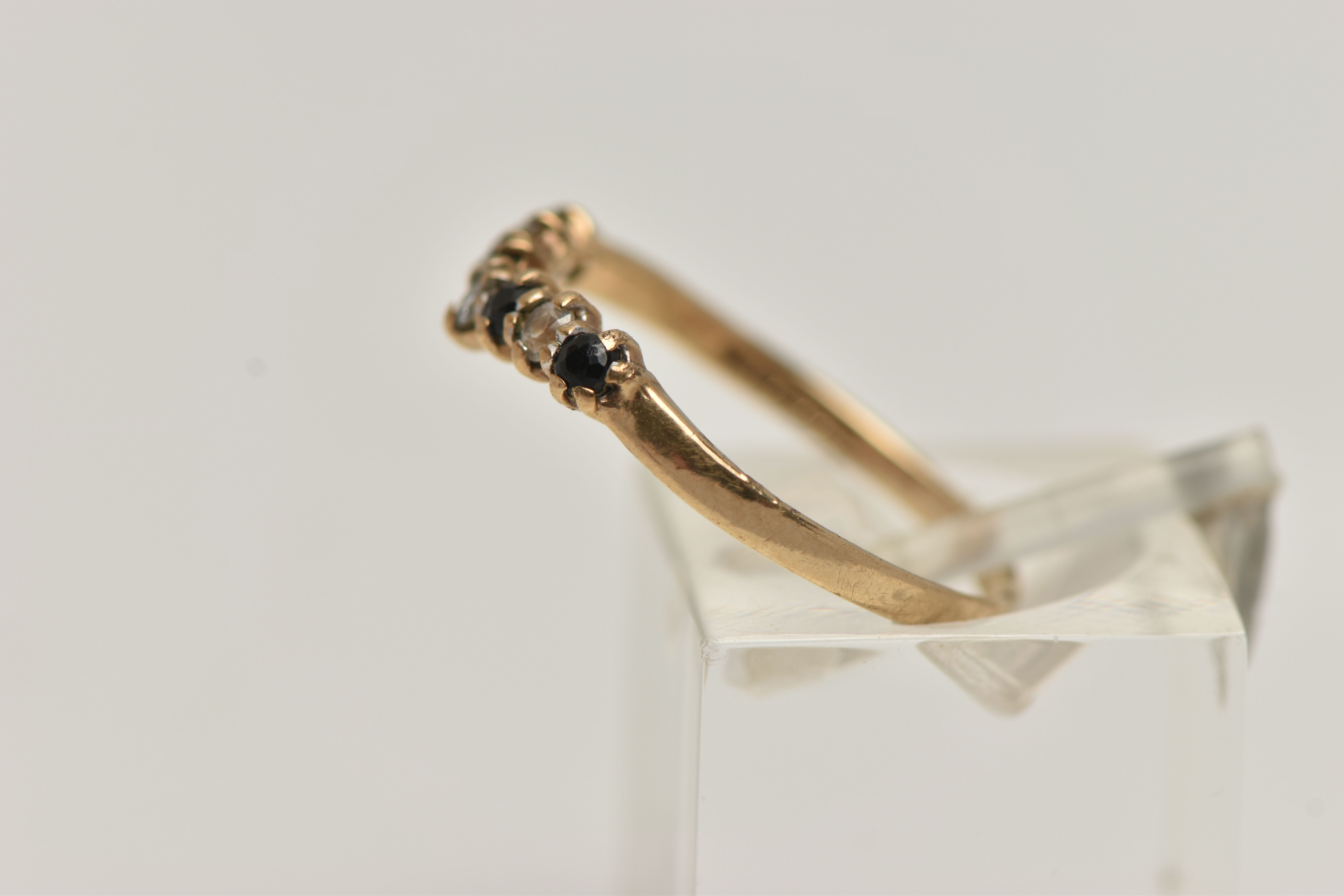 A 9CT GOLD SAPPHIRE AND CUBIC ZIRCONIA WISH BONE RING, alternating blue sapphires and colourless - Image 2 of 4