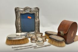 A BOX OF ASSORTED SILVER ITEMS, to include an Art Nouveau silver photo frame, hallmarked 'James