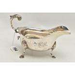 A LATE VICTORIAN SILVER GRAVY BOAT, polished form with engraved monogram and dated 1934-1959, wavy