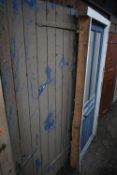 TWO BLUE PAINTED EXTERNAL WOODEN DOORS, both different ages and sizes, largest width 100cm x