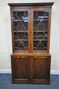 A GEORGIAN MAHOGANY ASTRAGAL GLAZED TWO DOOR BOOKCASE, over a two-door cupboard, top glazed bookcase