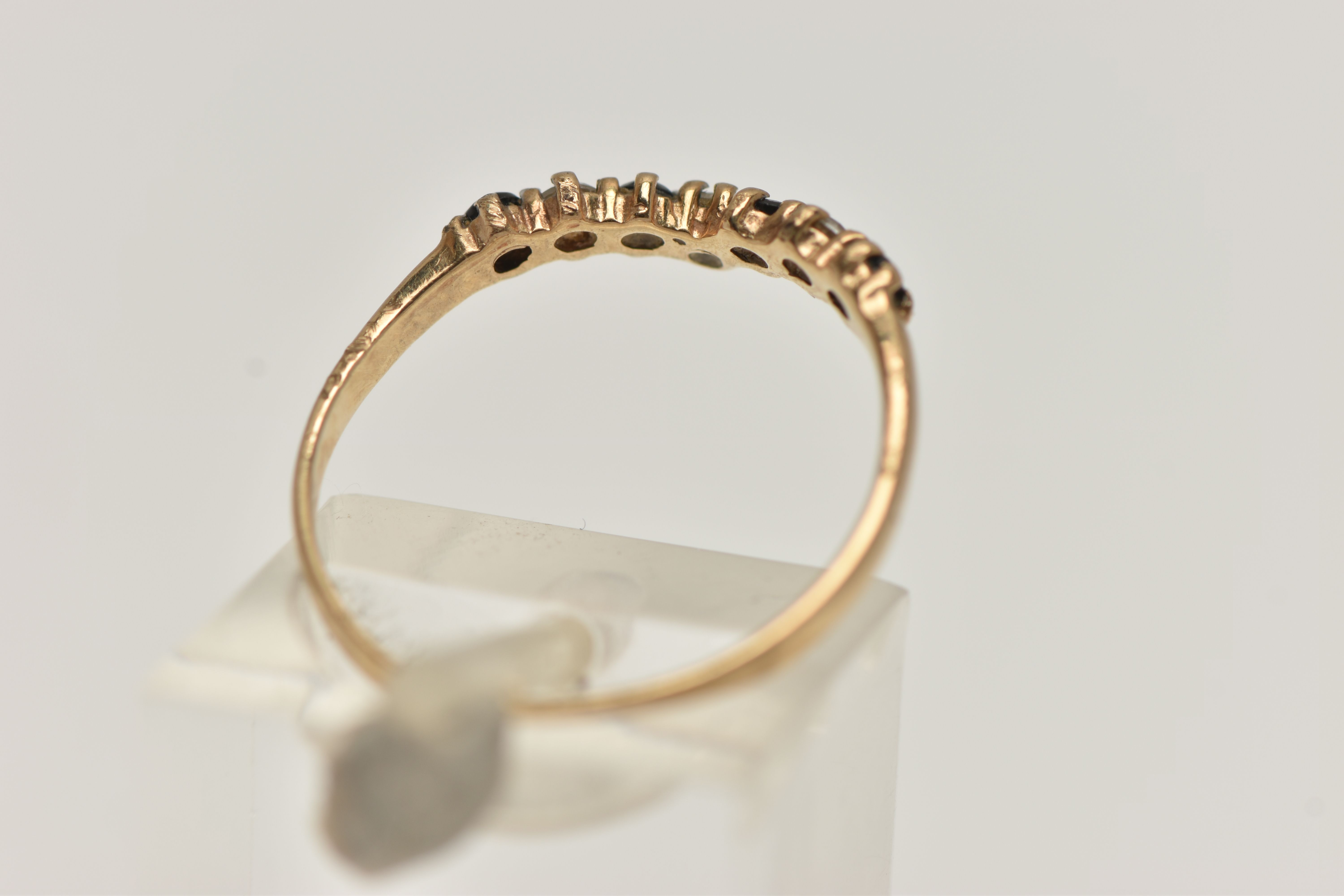 A 9CT GOLD SAPPHIRE AND CUBIC ZIRCONIA WISH BONE RING, alternating blue sapphires and colourless - Image 3 of 4