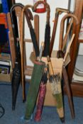 A BOX AND LOOSE WALKING STICKS, UMBRELLAS AND ARTIST'S EASEL, to include an artist's wooden