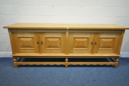 A DANISH HEAVY SOLID OAK SIDEBOARD, with four cupboard doors, the left side enclosing four