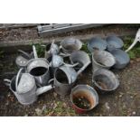 A SELECTION OF VARIOUS GALVANISED ITEMS, to include six sized watering cans, five buckets, including