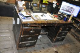 AN EARLY 20th CENTURY KNEEHOLE DESK with three drawers eith side of kneehole solid pine top with
