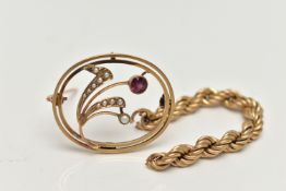 A YELLOW METAL GARNET AND SPLIT PEARL BROOCH, of an oval open work form, flower set with a