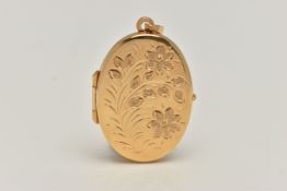 A 9CT GOLD LOCKET, oval form decorated with a floral pattern, hallmarked 9ct Birmingham import,