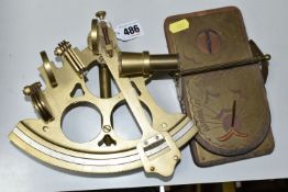 A BRASS SEXTANT AND PORTABLE SUNDIAL, the twentieth century brass sextant is unmarked, though