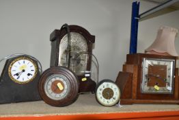 TWO CLOCKS TOGETHER WITH CLOCK PARTS, comprising an Art Deco circular wooden clock (missing base), a