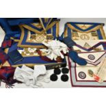 A BLACK BRIEFCASE WITH MASONIC REGLIA, to include four sashes some with medallions, six aprons,