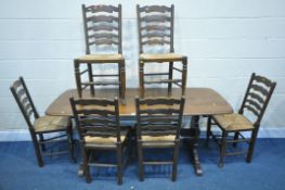 A DARK ERCOL DINING TABLE, length 183cm x depth 80cm x height 73cm, along with a set of six rush