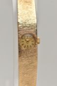 A LADYS 9CT GOLD 'BEUCHE-GIROD' WRISTWATCH, manual wind, round gold dial signed 'Bueche-Girod',