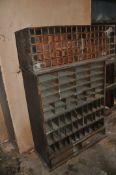TWO EARLY 20th CENTURY PIGEON HOLE CABINET the largest having vertical and horizontal slots, missing