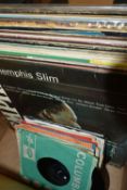 A BOX OF RECORDS, to include approximately fourteen vinyl singles and thirty six LPs, artists to