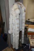 A MODERN FULL LENGTH REVERSIBLE LADIES FUR COAT, UK size 12/14, light brown suede on one side and