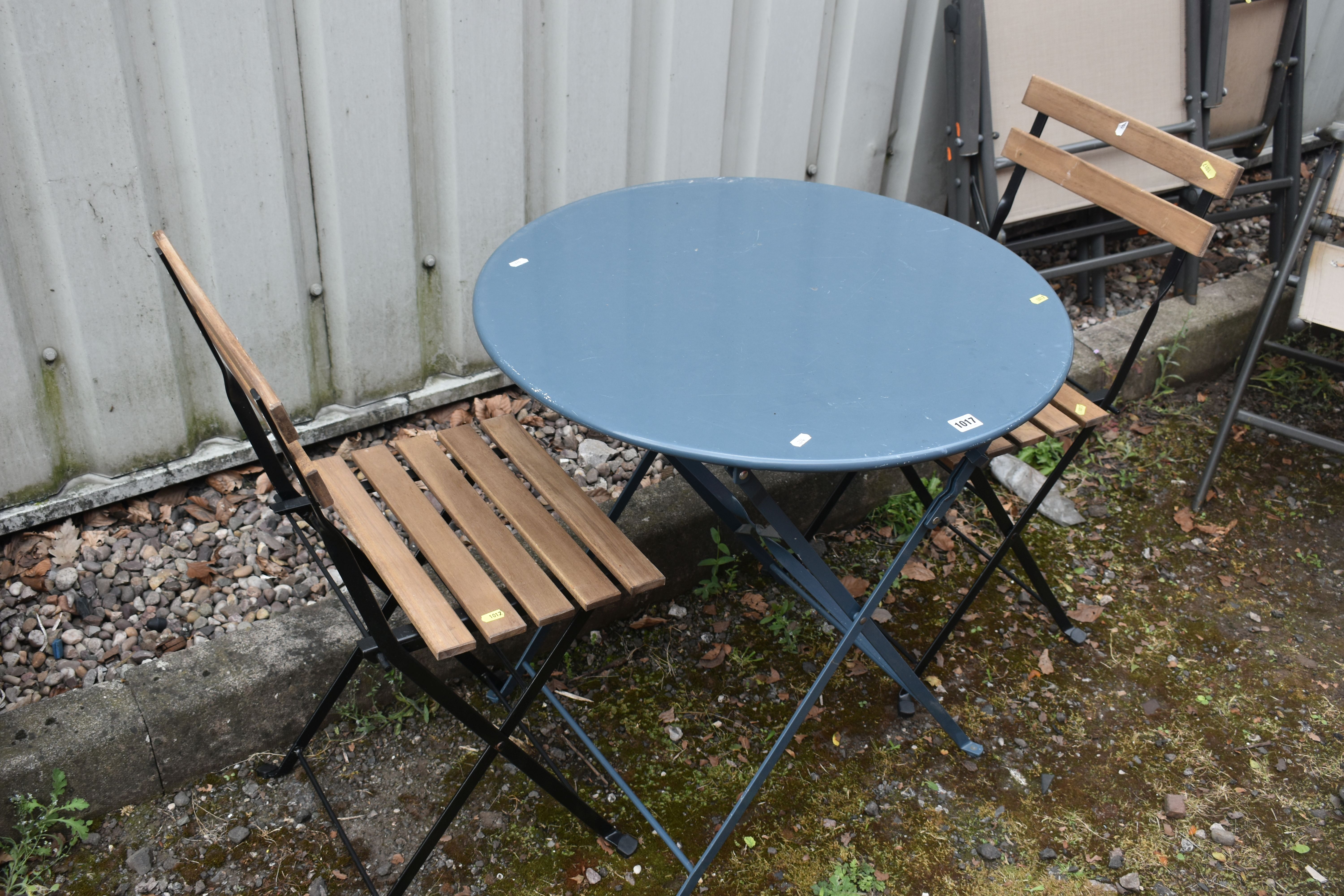 THREE FOLDING GARDEN ITEMS, to include a blue circular garden table, diameter 70cm x height 70cm,