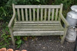 A TEAK SLATTED GARDEN BENCH, length 122cm (condition - appears sturdy but well weathered)