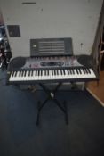 A CASIO LK-35 KEYBOARD AND STAND with power supply (PAT pass and working)