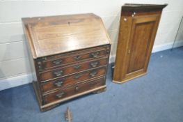 A GEORGIAN MAHOGANY AND CROSSBANDED BUREAU, fall front enclosing a fitted interior over four