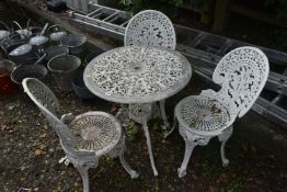 A WHITE PAINTED ALUMINIUM GARDEN BISTRO SET, comprising a circular table, with pierced foliate