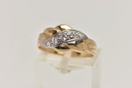 A 9CT GOLD CUBIC ZIRCONIA SET RING, designed with an asymmetrical row of graduated colourless, cubic
