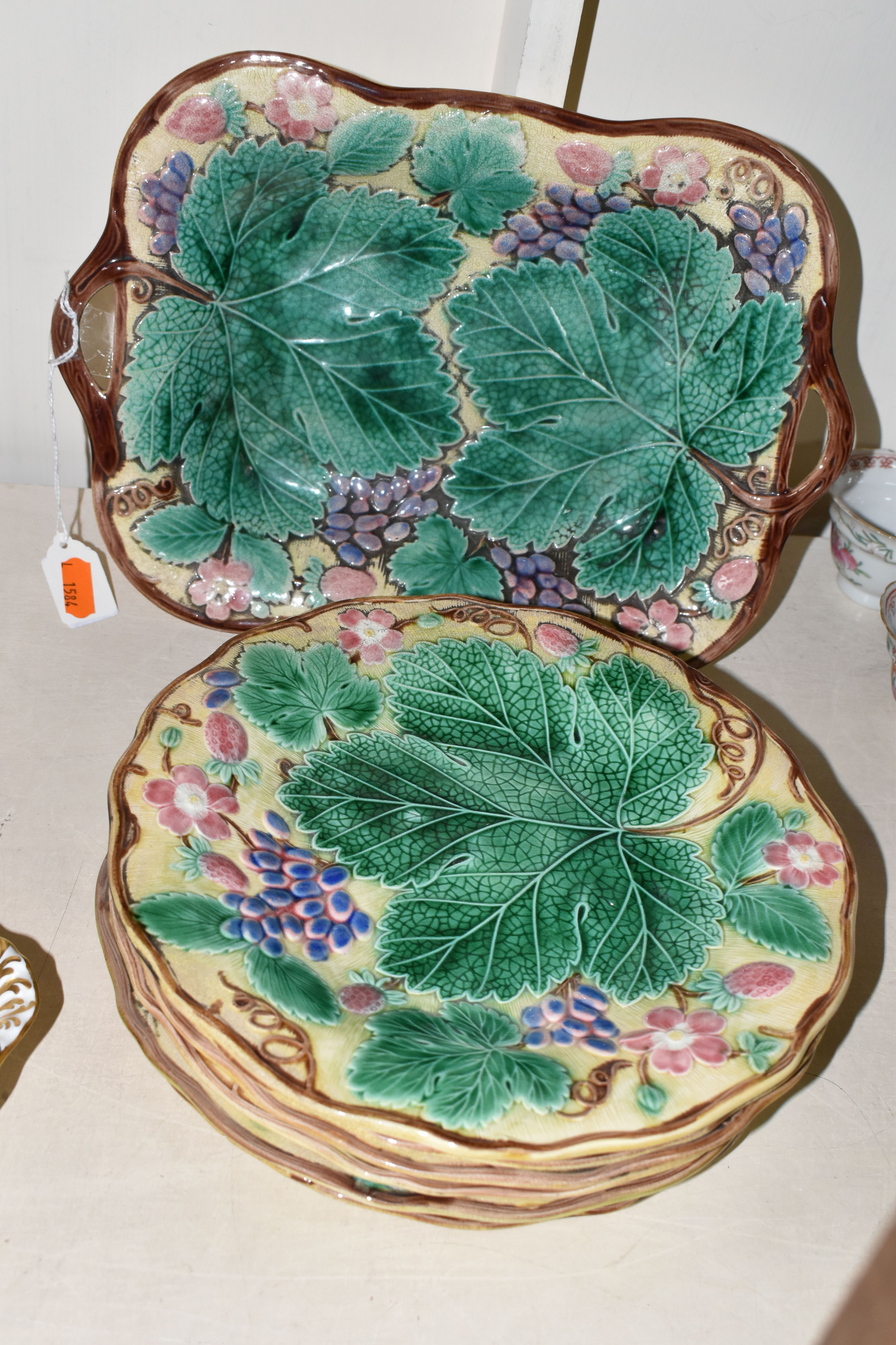 A SEVEN PIECE WEDGWOOD MAJOLICA PART DESSERT SERVICE, decorated with relief moulded vines and