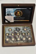 A BOXED SMALL GOLD COIN COLLECTION OF 12 X 0.5 gram, Ivory coast proof coins Pirates of the Seven