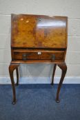A MID 20TH CENTURY BURR WALNUT LADIES BUREAU, the fall front door enclosing a fitted interior, above