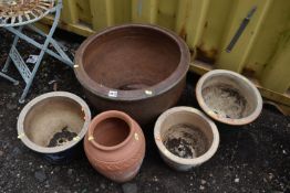 FIVE VARIOUS GARDEN POTS, to include a larger pot, diameter 52cm x height 38cm, three various glazed