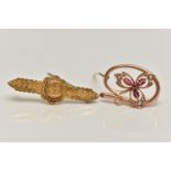 TWO LATE 19TH/EARLY 20TH CENTURY BROOCHES, the first an openwork floral brooch set with rubies and