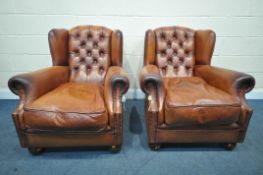 A PAIR OF OSKAR TETRAD TANNED LEATHER WING BACK ARMCHAIRS, with buttoned back and studded detail