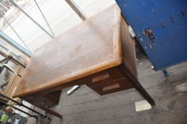 AN EARLY 20th CENTURY OAK DESK with two drawers either side of open knee hole standing on square