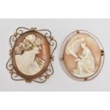 TWO YELLOW METAL CAMEO BROOCHES, the first of an oval form, carved shell depicting Hebe and Zeus