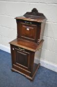 AN EDWARDIAN MAHOGANY TWO TIER PURDONIUM, with fall front top over a base with a pivoting door