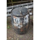 A BLACK PAINTED GALVANISED OIL BARREL, with a later added tap, diameter 66cm x height 92cm (