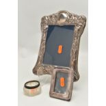 AN ASSORTMENT OF SILVER ITEMS, to include a floral silver photo frame engraved 'Val & Barry 1990,