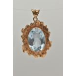 A 9CT GOLD BLUE TOPAZ PENDANT, yellow textured gold mount set with an oval cut light blue topaz,