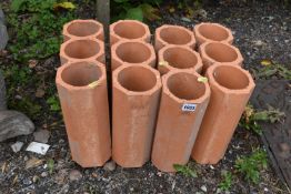 A SET OF OUR TERRACOTTA WINE RACKS, each with three sections (condition - slight wear) (4)