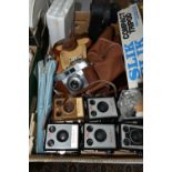 A BOX OF CAMERAS AND PHOTOGRAPHY EQUIPMENT, to include a cased Agfa camera with f2.8 45mm lens, a