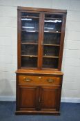 A 20TH CENTURY WALNUT SECRETAIRE BOOKCASE, the top with two glazed doors, enclosing four shelves,
