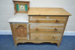 A PINE WASHSTAND, with three drawers, beside a single cupboard door, with a tiled back marble top,