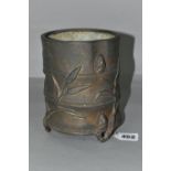 A 19TH CENTURY CHINESE BRONZE BRUSH POT, of bamboo form, cast with shoots and leaves, on three