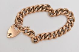 A ROSE METAL CURB LINK BRACELET, hollow links, fitted with a heart padlock clasp, stamped 9ct,